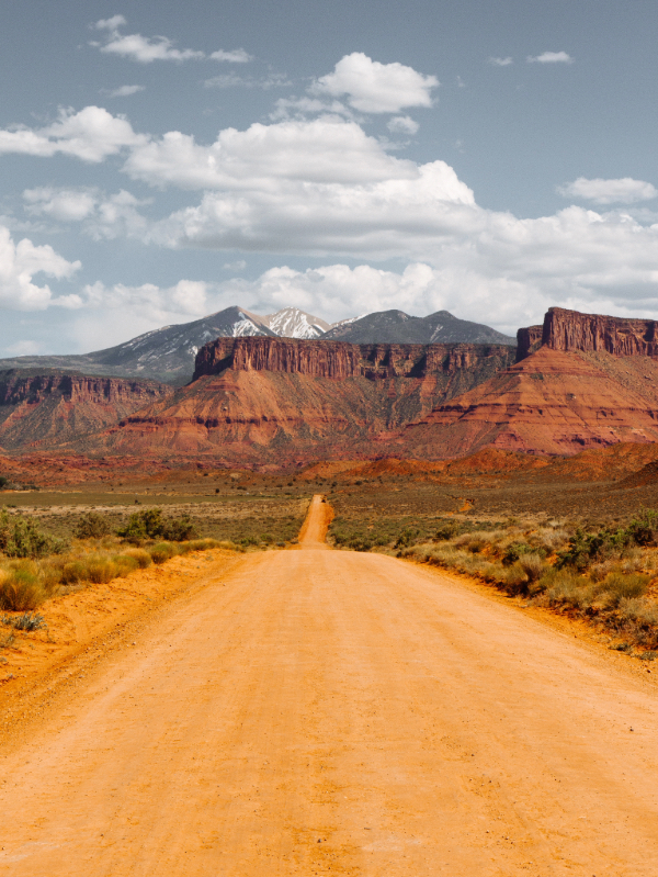 a dirt road leading to canyon