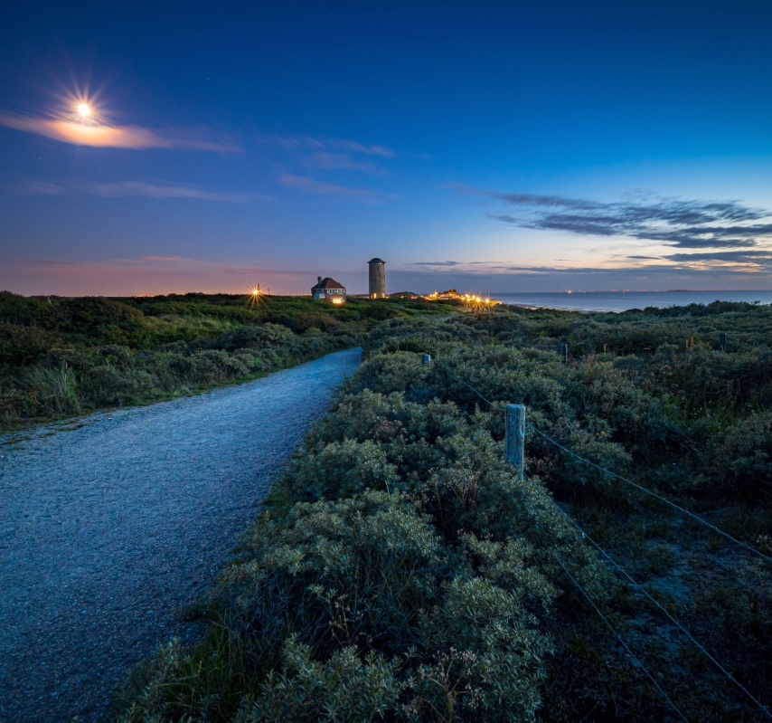 a road to a lighthouse