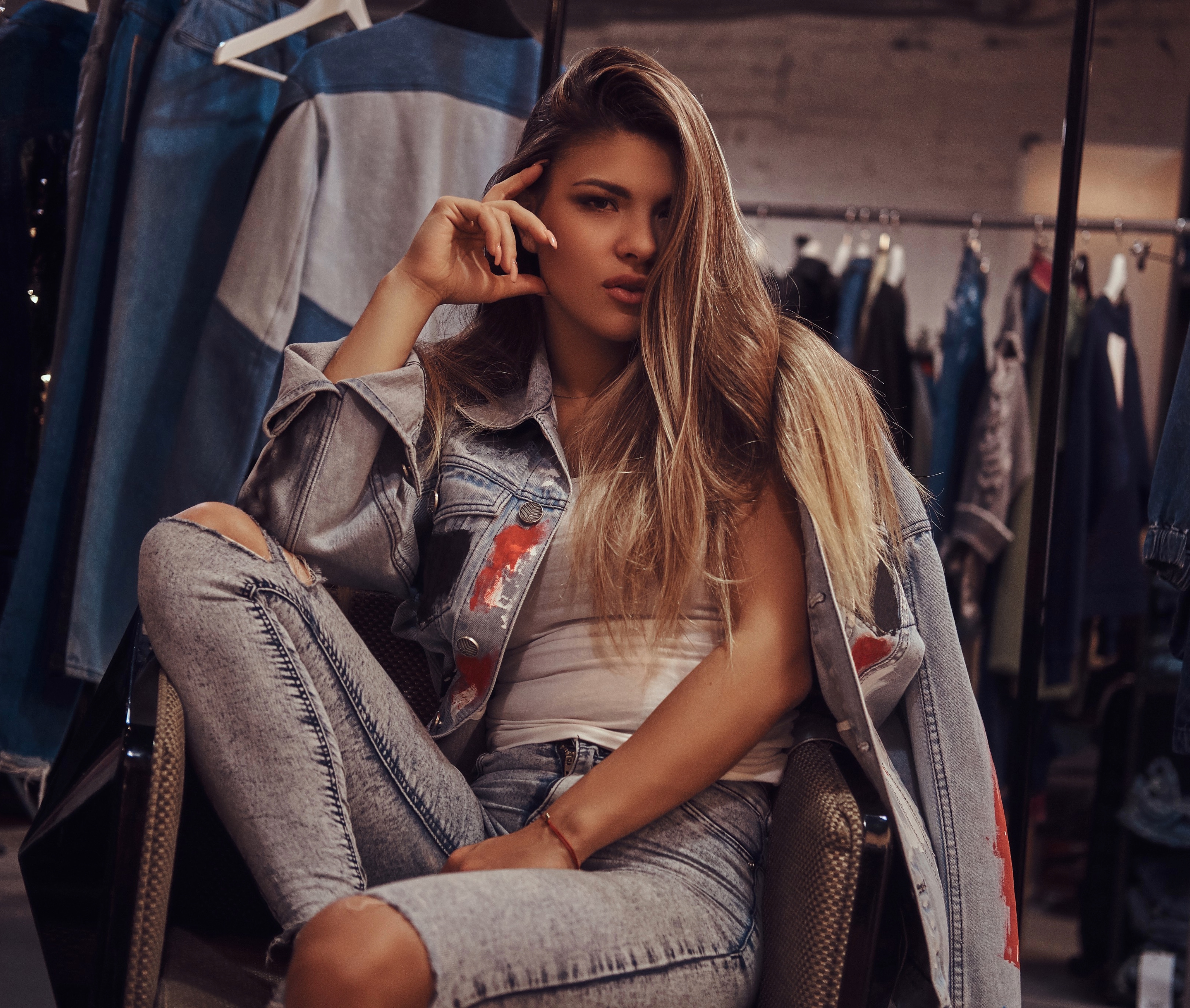 a model in a denim jacket