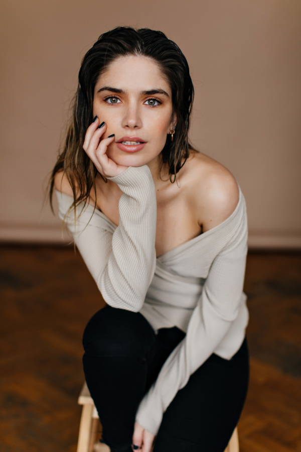 A model in a grey sweater